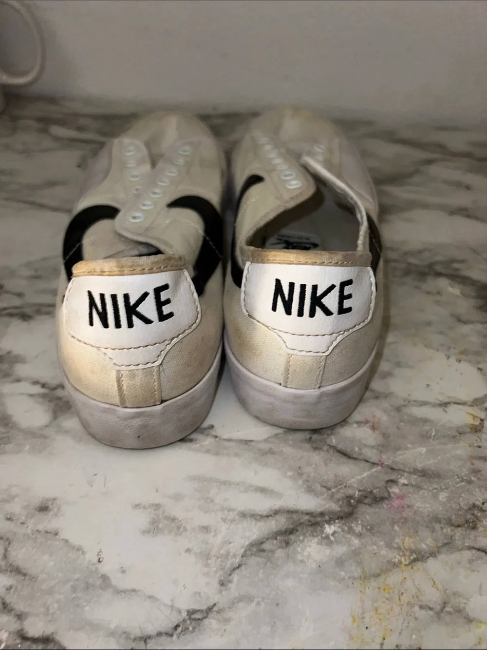 Nike Men’s White Canvas Slip-On Sneakers with Black Swoosh